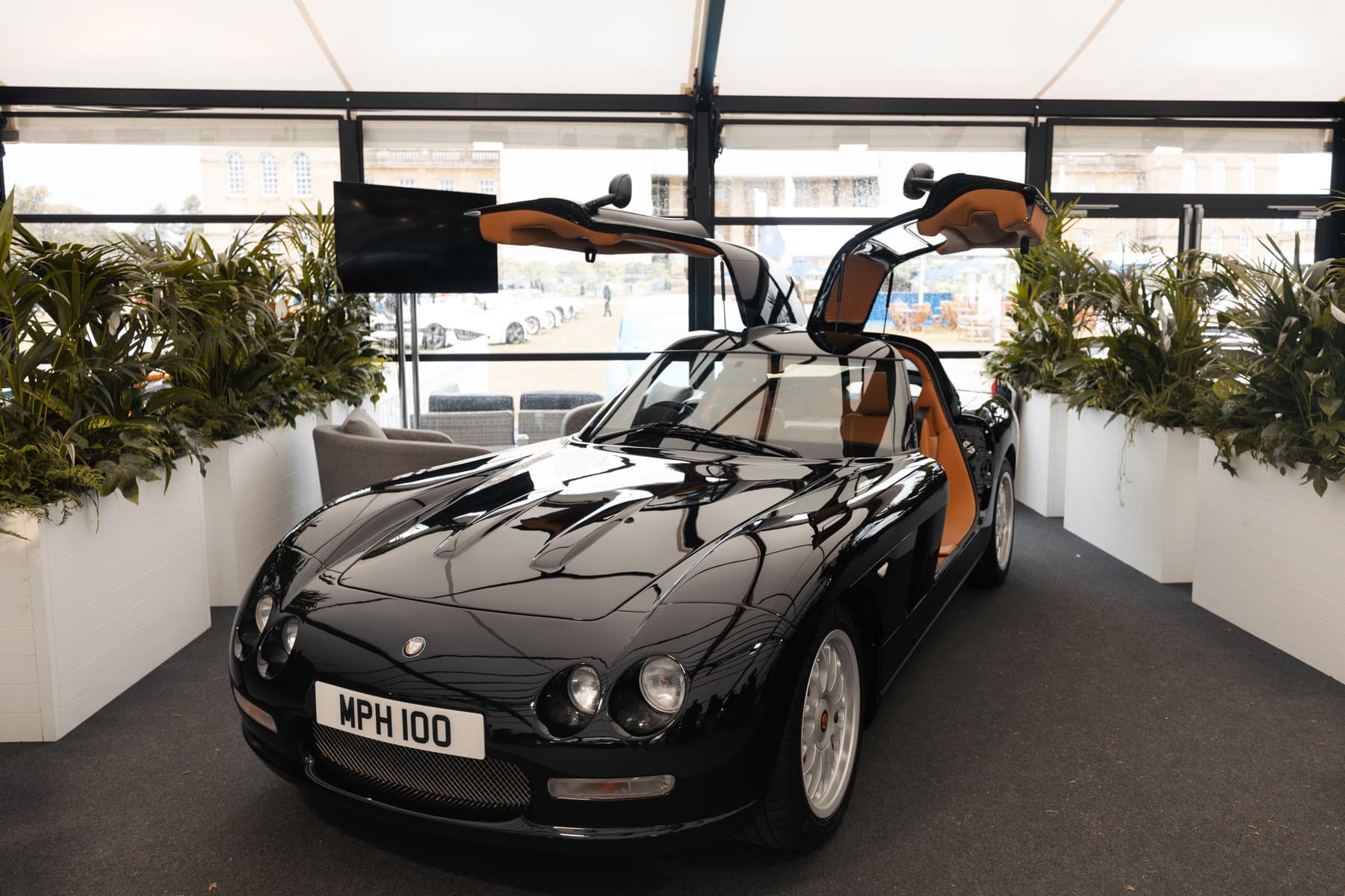 Front view of the black Bristol Fighter with gullwing doors open