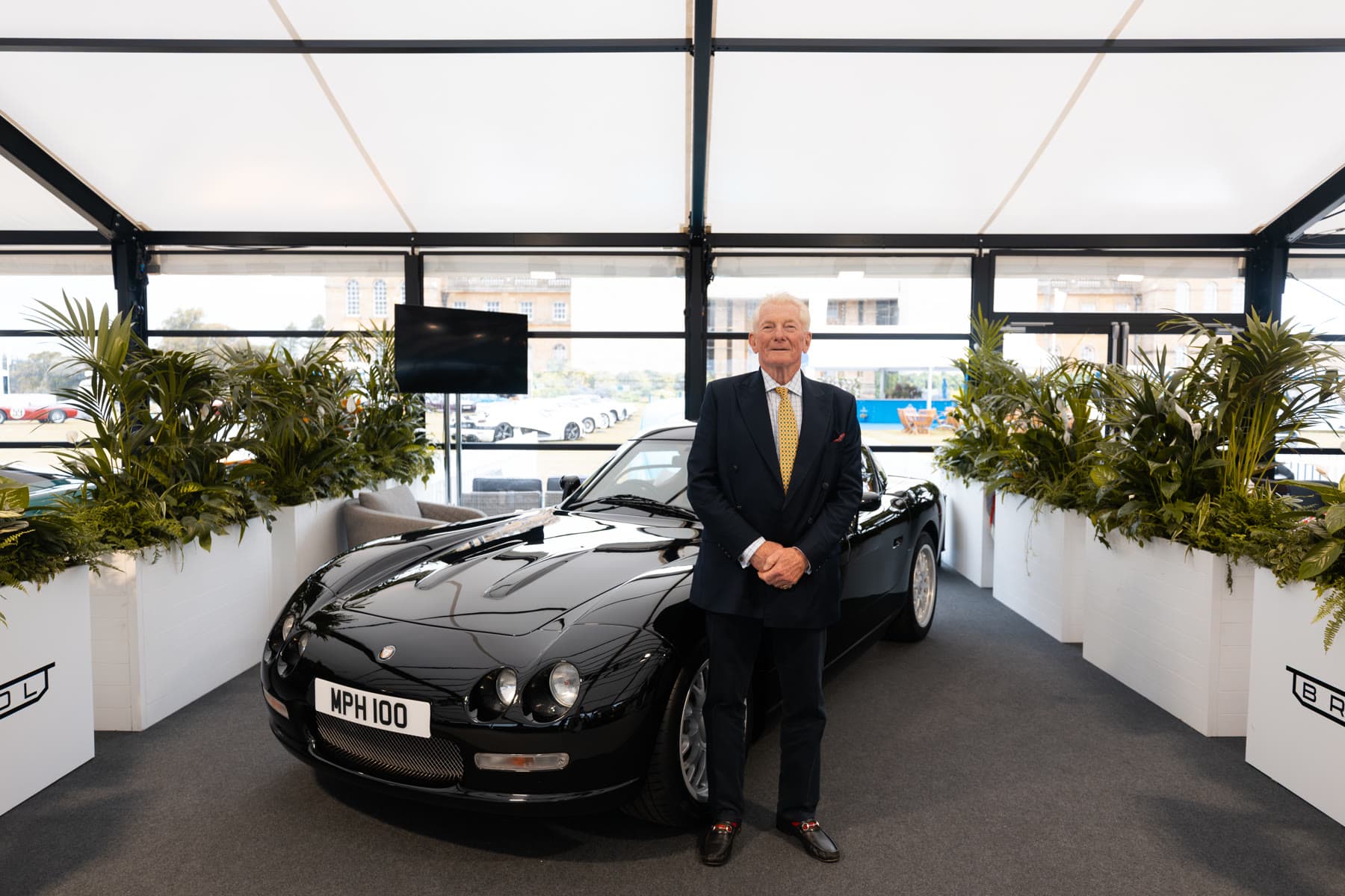 Richard Hackett, Chairman of Bristol Cars Group, with the completed black Bristol Fighter at Salon Privé 2026
